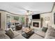Cozy living room featuring a fireplace, plush furniture, and abundant natural light at 1945 Wenlok Ne Trl, Marietta, GA 30066