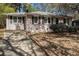 Charming single-story home with a brick facade, dark shutters, and a well-maintained front lawn at 2564 Brentwood Rd, Decatur, GA 30032