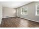 Bright living room featuring wood-look flooring, natural light from windows, and a neutral paint palette at 2564 Brentwood Rd, Decatur, GA 30032
