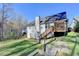 Picture of the yard, deck, and exterior, landscaped with retaining walls, ideal for outdoor living at 4960 Markim Forest Ln, Sugar Hill, GA 30518