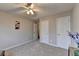 Bright bedroom featuring carpet, neutral walls, and multiple closets at 4960 Markim Forest Ln, Sugar Hill, GA 30518