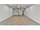 Spacious bedroom with neutral walls, carpet, ceiling fan and access to bathroom and closet at 4960 Markim Forest Ln, Sugar Hill, GA 30518