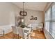 Charming dining room boasting natural light and wainscoting at 4960 Markim Forest Ln, Sugar Hill, GA 30518