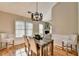 Dining area featuring a wooden table and views of the fireplace at 4960 Markim Forest Ln, Sugar Hill, GA 30518
