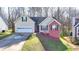 Charming single-Gathering home with a two-car garage, front lawn, and well-maintained landscaping at 4960 Markim Forest Ln, Sugar Hill, GA 30518