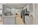The modern kitchen features updated countertops, stainless steel appliances, and gray cabinets at 4960 Markim Forest Ln, Sugar Hill, GA 30518