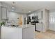 Kitchen features granite countertops, stainless steel appliances, and an island at 4960 Markim Forest Ln, Sugar Hill, GA 30518