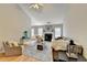 Spacious living room with vaulted ceilings, fireplace, and hardwood flooring at 4960 Markim Forest Ln, Sugar Hill, GA 30518