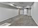 Spacious carpeted room with neutral walls, recessed lights and a rear entry at 4960 Markim Forest Ln, Sugar Hill, GA 30518