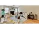 Bright living room with fireplace, neutral decor, and hardwood floors at 4960 Markim Forest Ln, Sugar Hill, GA 30518