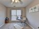 Inviting home office with a modern desk, neutral carpet, and artwork, designed for productivity and comfort at 4960 Markim Forest Ln, Sugar Hill, GA 30518