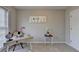 Functional home office featuring a modern desk, neutral carpet, and ample space for a productive work environment at 4960 Markim Forest Ln, Sugar Hill, GA 30518