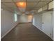 Spacious finished basement with wood-look floors, painted walls and drop ceiling at 2703 Rainbow Forest Dr, Decatur, GA 30034