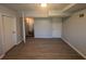 Spacious finished basement with updated vinyl flooring, neutral paint, and convenient access to the staircase at 2703 Rainbow Forest Dr, Decatur, GA 30034