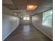 Large basement with updated vinyl flooring, two windows for natural light, and a neutral color palette at 2703 Rainbow Forest Dr, Decatur, GA 30034