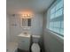 Bathroom with white tile, vanity, toilet, and shower at 2703 Rainbow Forest Dr, Decatur, GA 30034