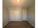 This bedroom features modern vinyl floors, closet, and a neutral color scheme for versatile decorating options at 2703 Rainbow Forest Dr, Decatur, GA 30034