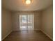Bright dining area with sliding glass doors leading to outdoor space, and new floors at 2703 Rainbow Forest Dr, Decatur, GA 30034