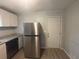 Functional kitchen with stainless steel refrigerator and plenty of cabinet space at 2703 Rainbow Forest Dr, Decatur, GA 30034
