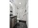 Updated bathroom with stylish shower, sleek vanity, modern fixtures, and elegant tile work at 3970 Scott Dr, Forest Park, GA 30297
