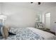 Inviting bedroom showcasing a patterned bedspread, side chair and an open closet at 3970 Scott Dr, Forest Park, GA 30297