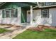 Close up of the front entrance with a white door, matching trim, and freshly manicured lawn at 3970 Scott Dr, Forest Park, GA 30297