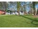 Charming home with a lush lawn and towering trees offering ample shade and curb appeal at 3970 Scott Dr, Forest Park, GA 30297
