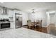Bright kitchen featuring stainless steel appliances and an adjacent dining area at 3970 Scott Dr, Forest Park, GA 30297