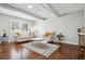 Cozy living room with hardwood floors, large windows, and stylish decor at 3970 Scott Dr, Forest Park, GA 30297