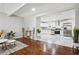Open concept living space with hardwood floors seamlessly connecting to a modern kitchen at 3970 Scott Dr, Forest Park, GA 30297