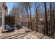 Back deck overlooking trees with black metal railing and outdoor seating at 600 Jardin Ct # 48, Alpharetta, GA 30022