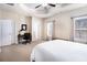 Bedroom featuring a ceiling fan, multiple windows, and a small work space at 600 Jardin Ct # 48, Alpharetta, GA 30022