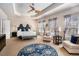 Spacious bedroom features a tray ceiling, sitting area, and ensuite bathroom at 600 Jardin Ct # 48, Alpharetta, GA 30022