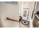 Inviting foyer with a white front door, hardwood floors, and decorative rug at 600 Jardin Ct # 48, Alpharetta, GA 30022