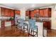 Spacious kitchen with rich wood cabinetry, stainless steel appliances, and bar seating at 600 Jardin Ct # 48, Alpharetta, GA 30022