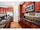 Well-appointed kitchen featuring stainless steel appliances, granite countertops, and ample cabinet space at 600 Jardin Ct # 48, Alpharetta, GA 30022