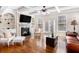Cozy living room featuring a fireplace, built-in shelves, and hardwood floors at 600 Jardin Ct # 48, Alpharetta, GA 30022