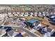 Aerial view of community showing well-maintained homes, sidewalks, and amenities including pool and tennis courts at 7545 Rambling Vale, Cumming, GA 30028