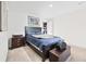 Simple bedroom featuring a dark bedframe, with carpeted floors at 7545 Rambling Vale, Cumming, GA 30028