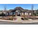 Community clubhouse with stone accents, flanked by landscaping and sidewalks providing access for residents at 7545 Rambling Vale, Cumming, GA 30028