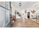 Bright foyer with wood floors, elegant staircase, and decorative elements that create a welcoming atmosphere at 7545 Rambling Vale, Cumming, GA 30028