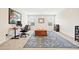 Spacious living room with office area and natural light at 7545 Rambling Vale, Cumming, GA 30028