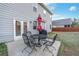 Cozy patio with outdoor seating and grill at 7545 Rambling Vale, Cumming, GA 30028