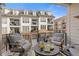 Relaxing balcony features comfortable seating and views of the building exterior at 310 Burgess Walk, Alpharetta, GA 30009
