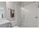 Bathroom with tiled shower featuring glass door, sleek fixtures, and modern design at 310 Burgess Walk, Alpharetta, GA 30009