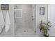 Contemporary bathroom featuring a glass shower with marble tile and modern fixtures at 310 Burgess Walk, Alpharetta, GA 30009