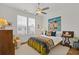 Cozy bedroom with large window, comfortable bed, colorful decor and plenty of natural light at 310 Burgess Walk, Alpharetta, GA 30009