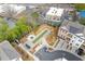 Aerial view of community area featuring bocce ball court, BBQ grills, and manicured landscaping at 310 Burgess Walk, Alpharetta, GA 30009