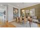 Elegant dining area featuring stylish lighting and decor adjacent to living space at 310 Burgess Walk, Alpharetta, GA 30009