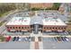 Exterior shot of The Maxwell building highlighting its architecture, parking area, and surrounding landscape at 310 Burgess Walk, Alpharetta, GA 30009